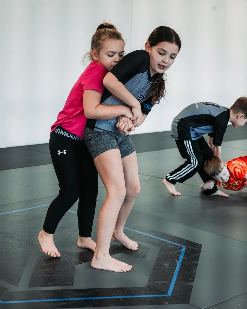 Kids practicing takedown technique at Vanguard